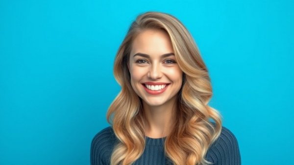 Portrait of a smiling woman with wavy blonde hair, Soleo Health Rare Disease Strategy expert.