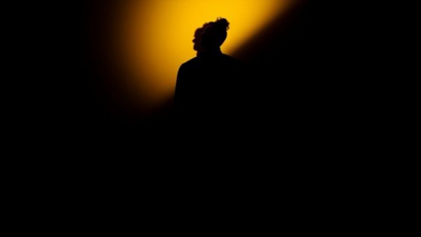 Understanding consciousness in elderly care through dramatic silhouette art.