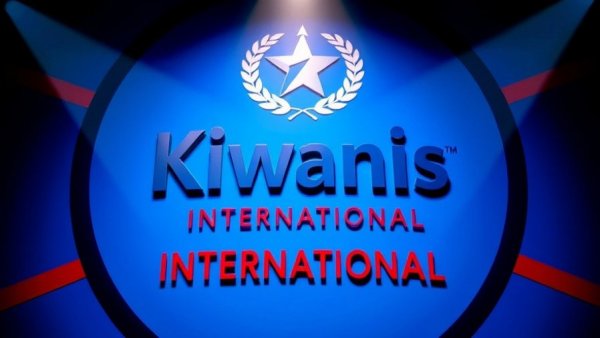 Kiwanis International logo on blue background with red accents.