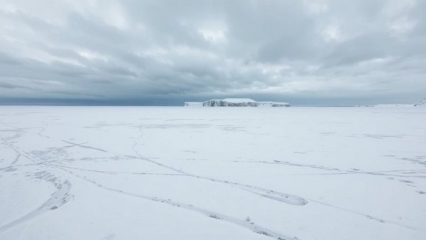 Michigan Canada ice bridge travel scene over frozen landscape.