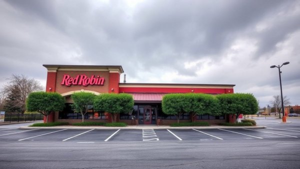 Closed Red Robin restaurant with empty parking lot.