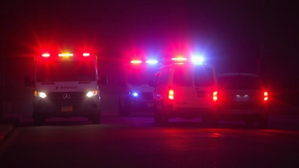 Emergency response vehicles with lights during Union City tornado recovery.