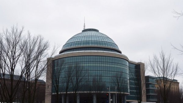 Marquette Regional History Center in winter, dome-topped modern building.