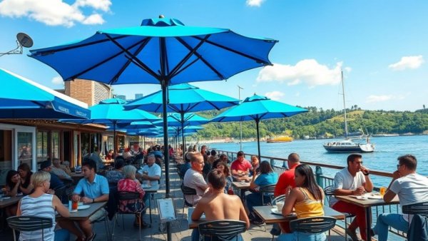 Boatwerks Waterfront Restaurant outdoor dining with blue umbrellas and waterfront view.