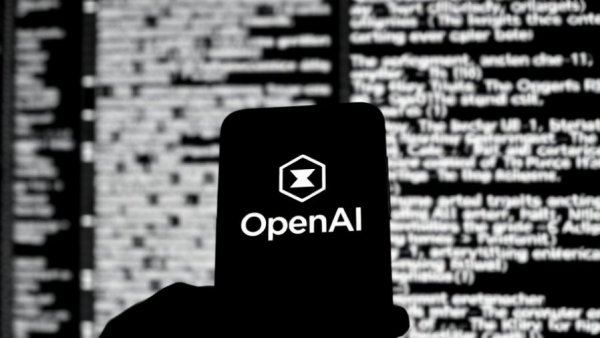 Monochrome OpenAI logo on smartphone, text in background, AI for health advice.
