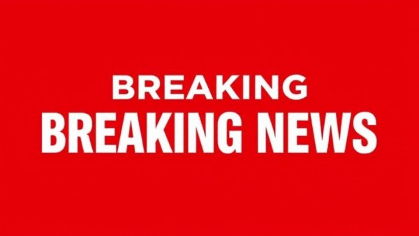 Breaking news banner with bold text on a red background.