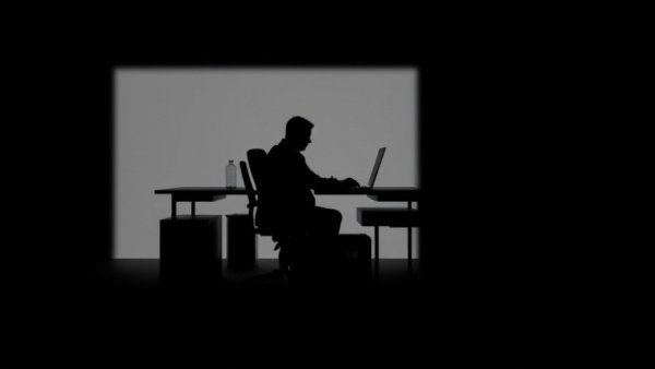 Silhouetted businessman illustrating shadow AI management strategies.