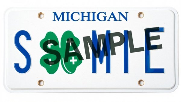 Close-up of a Michigan 4-H license plate with 4-H clover logo.