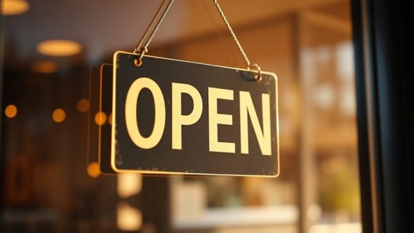 Connecticut small business concierge program open sign reflecting sunlight.