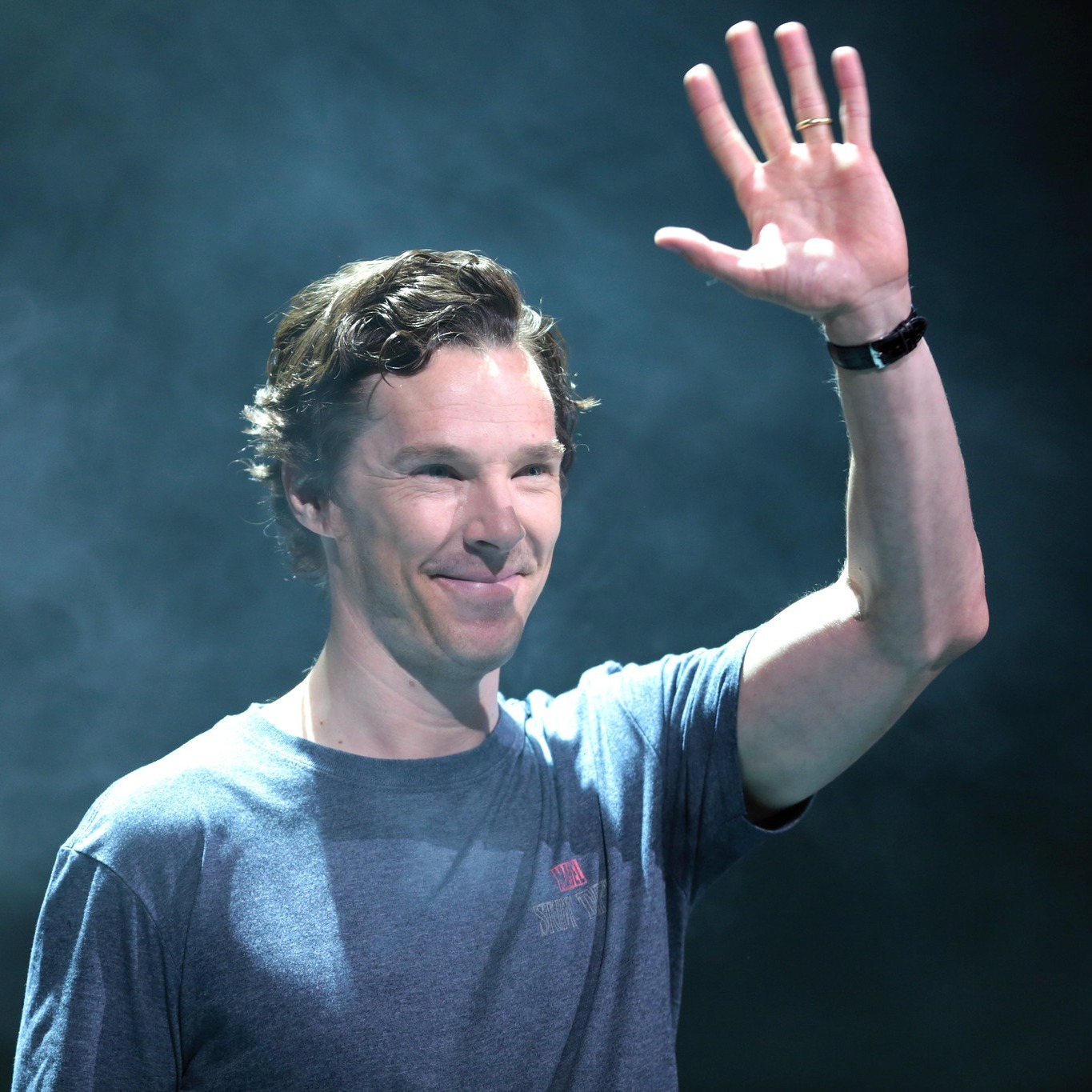 Benedict Cumberbatch waves off his guests after they have joined him for an afternoon of bouncy castle hire - apparently