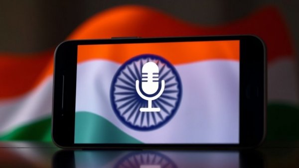 Voice AI in India technology represented on smartphone with Indian flag.
