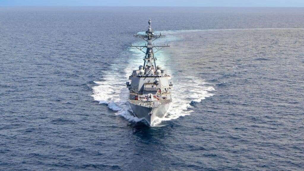 USS Ted Stevens Delivery ceremony with officials signing documents.