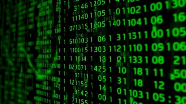 Flowing green code on a dark background representing GSmart Risk Insights.