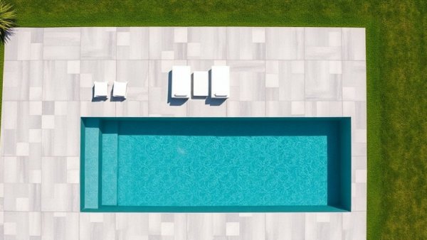 Aerial view of a modern swimming pool with loungers