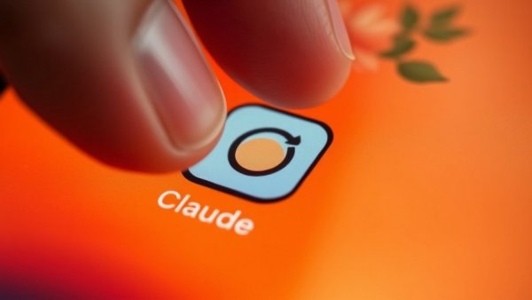 AI watermarking in Claude app icon being touched on phone screen