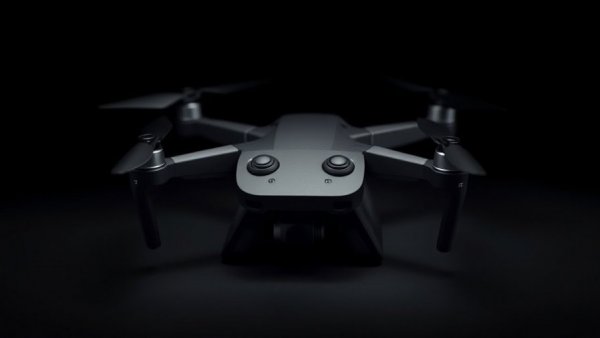 Sleek black tethered drone technology control unit with modern design.