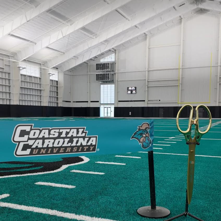 Coastal Carolina University indoor practice facility, exterior and interior views.