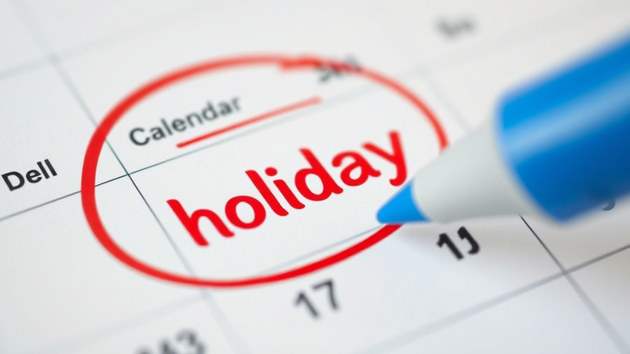 Close-up of calendar with 'holiday' circled, symbolizing Holidays in Slovenia 2026.