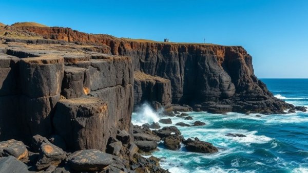 Scotland travel tips for visiting majestic Fingal's Cave on rocky shores.