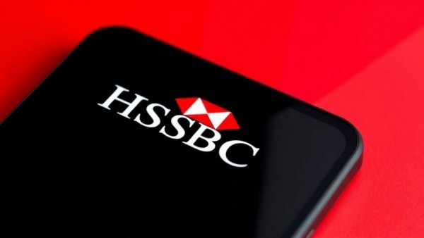 HSBC logo on phone screen with red background.