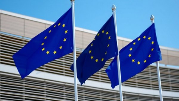 EU flags in front of modern building, illustrating Industrial Accelerator Act EU Manufacturing
