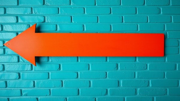 Bold arrow on teal wall, pointing left. Signs you're ready to get wealthy.