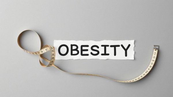 GLP-1 medicines for obesity treatment concept with measuring tape.