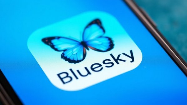 Bluesky app logo on smartphone screen, AI tools for small business Texas.