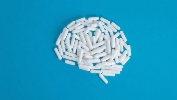 Creative brain shape made of pills representing digital twins in medicine.