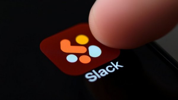 Close-up of AI-powered Slack app icon on phone screen.