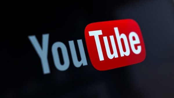 AI-powered YouTube search feature; close-up of YouTube logo.