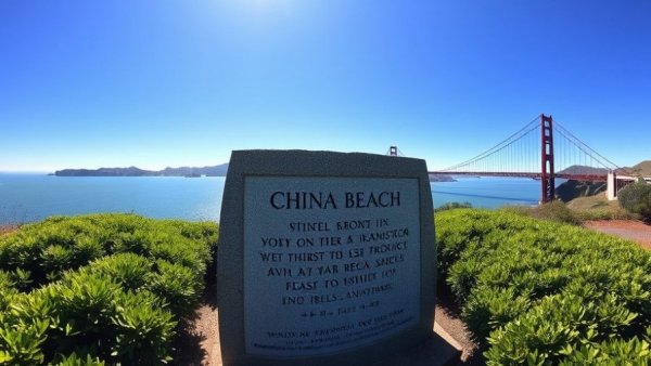 China Beach monument with Golden Gate Bridge in bright sunlight.