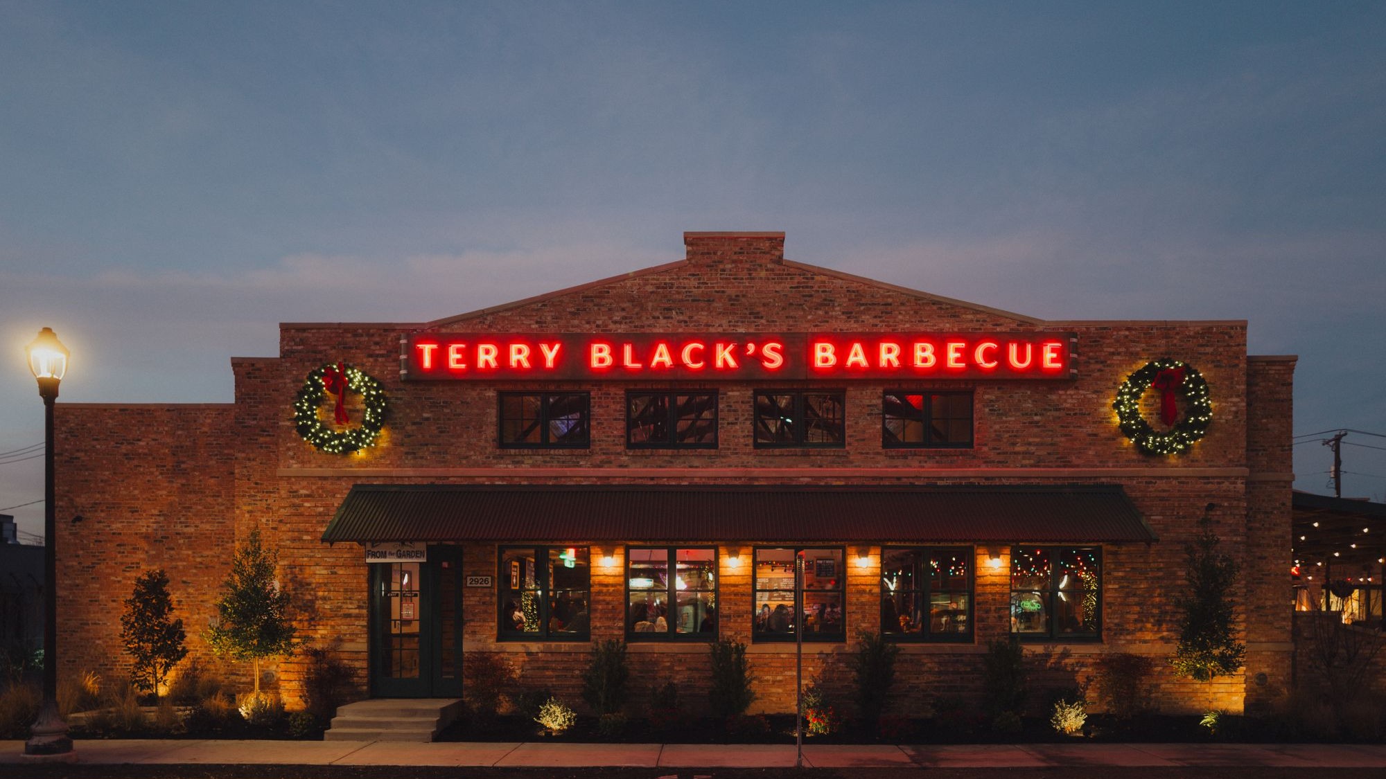 Chef with ribs at Terry Black’s Barbecue Fort Worth.