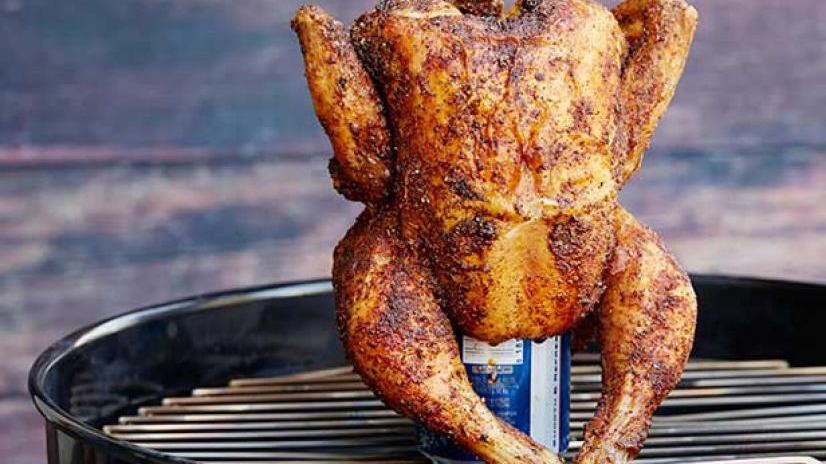 Golden BBQ chicken on a grill with crispy skin, showcasing backyard grilling perfection.