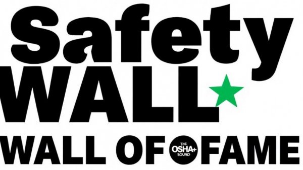 Workplace safety program sign with stars and logo.