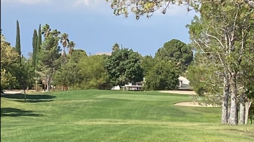 Green Tree Golf Course staff welcomes golfers at modern clubhouse entrance.