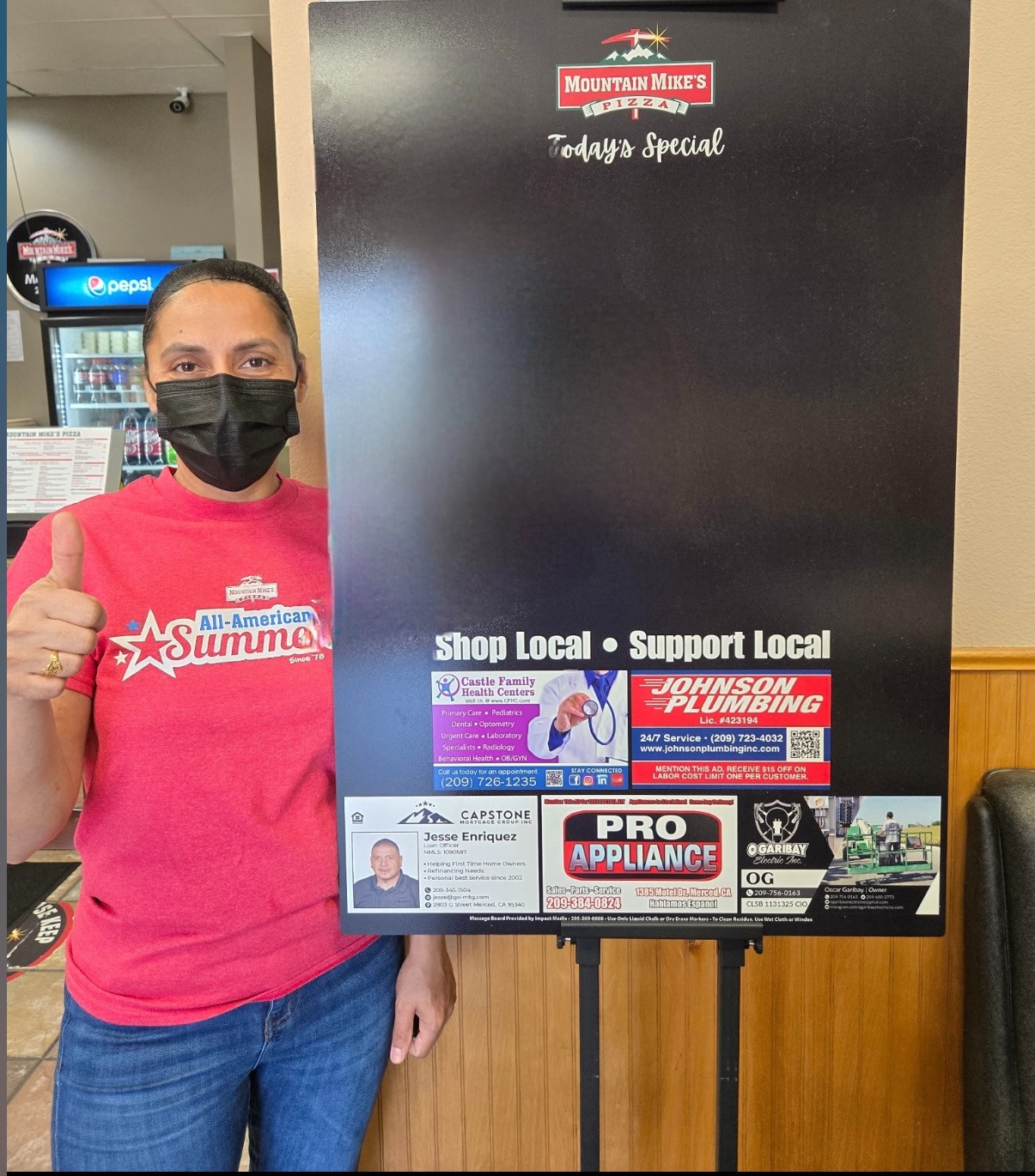 shoplocallove concert, elevated expressions, enjoying performances, photorealistic, open-air stage with a band playing, highly detailed, sound waves reverberating, high-def, cool blues, stage floodlights, shot with a fisheye lens.