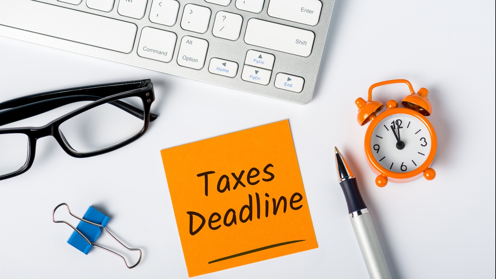 marked calendar showing tax deadline, intense expression, highlighting, photorealistic, home office with wall clock, highly detailed, newspaper clippings, deep focus, warm color tones, natural ambient lighting, shot with a 35mm lens.