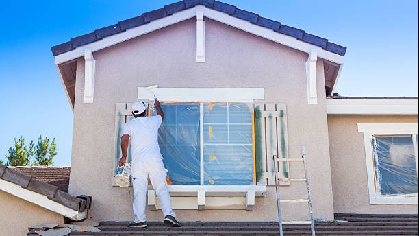 collaborative painting artist, shared enthusiasm, mixing colors seamlessly, photorealistic, communal art space with shared materials, highly detailed, cooperative action, ultra-sharp focus, warm and earthy palette, directional studio lighting, shot with a zoom lens.