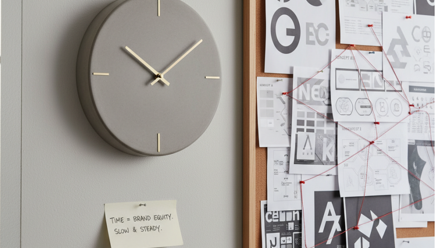 Close-up of a clock symbolizing time investment in brand development.