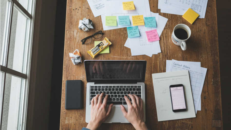 Strategic planning for small business content marketing strategy at a desk.