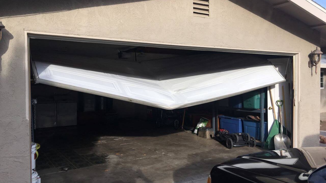 exterior view garage door sagging misalignment garage door repair near me
