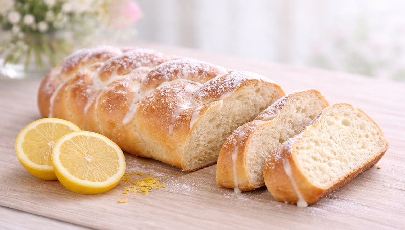fresh baked lemon easter bread with glaze and powdered sugar
