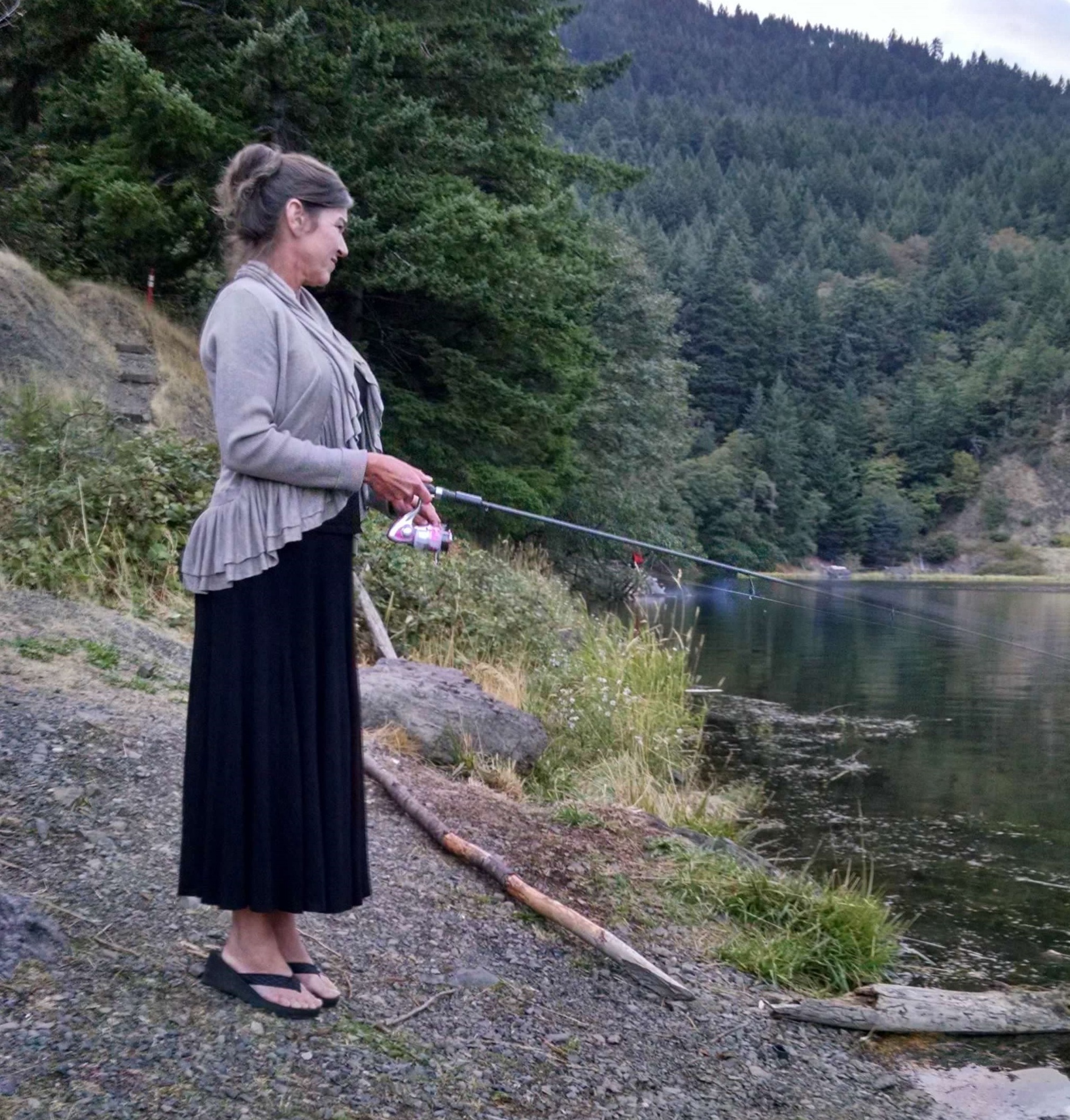 Tax preparer, Cheryl, fishing in the Lewis River, after work in Woodland.