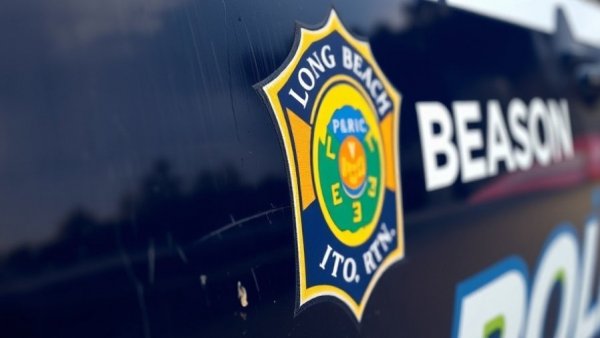 Long Beach Police logo on vehicle, related to Long Beach shooting arrests.