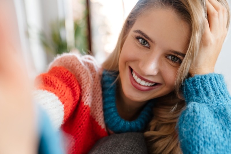 Girl Smiling after Full Mouth Mono Implant reconstruction