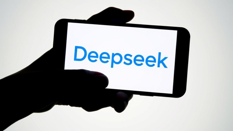 Silhouette holding phone with Deepseek v3.1 logo, AI news.