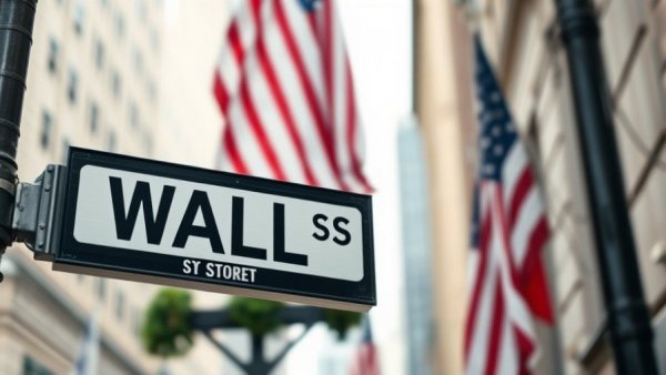 Wall Street sign with blurred American flag, related to upcoming IPOs of SpaceX OpenAI Anthropic.