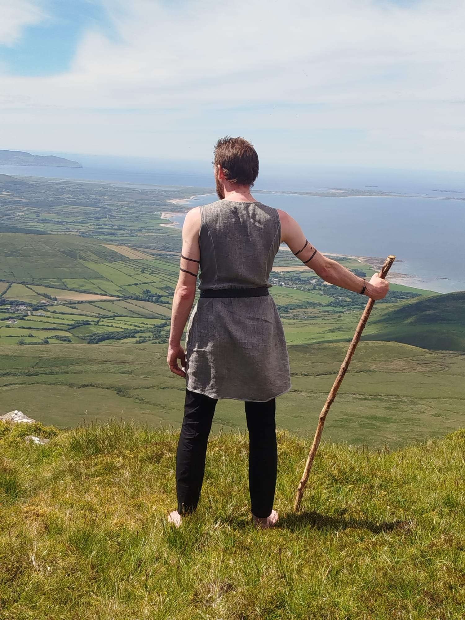Foinse performer on the slopes of Caherconree overlooking the Kerry coast