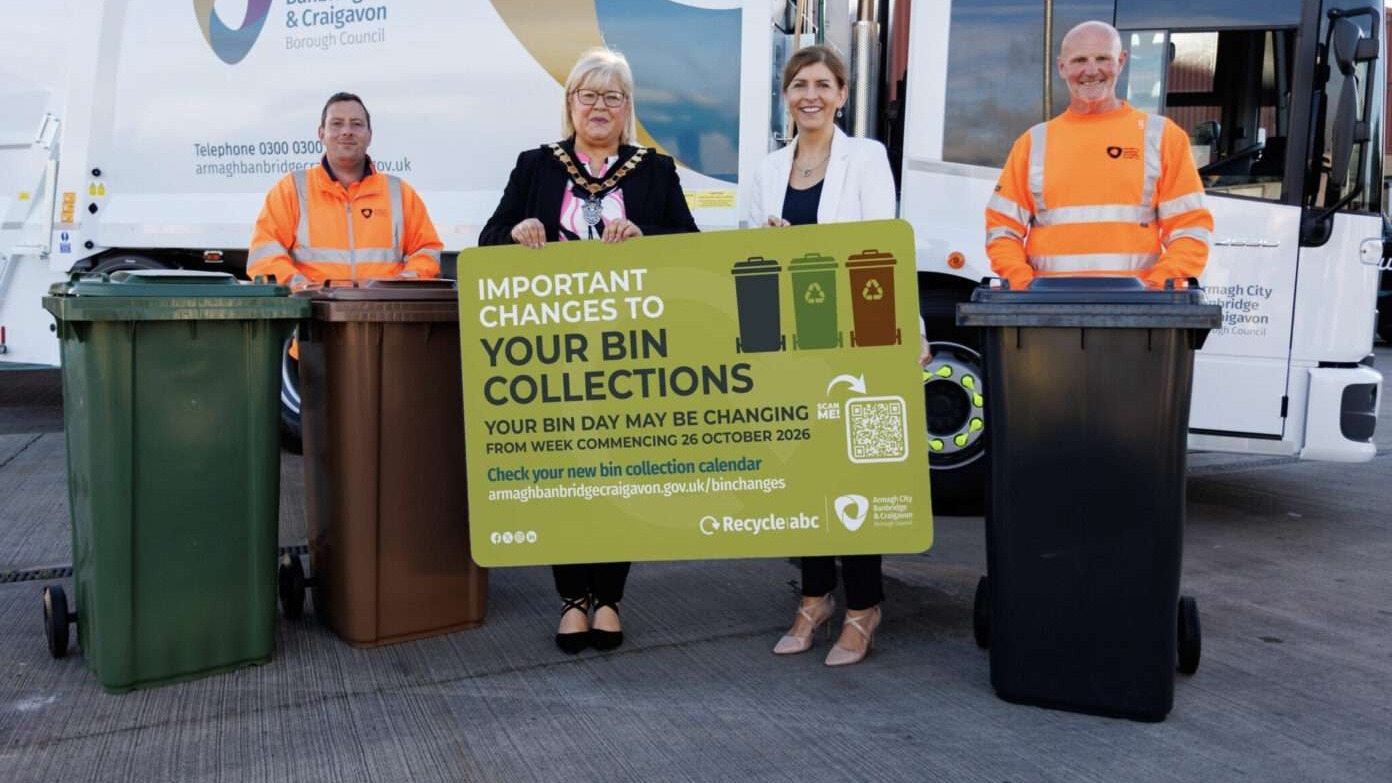 Lord Mayor Councillor Mary O’Dowd and council staff holding a sign announcing ABC Council bin collection day changes from 26 October 2026